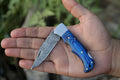 Best Folding Hunting Knife – 7” Handmade Damascus Steel Blade with Pakkawood Handle, Steel Bolster & Leather Sheath